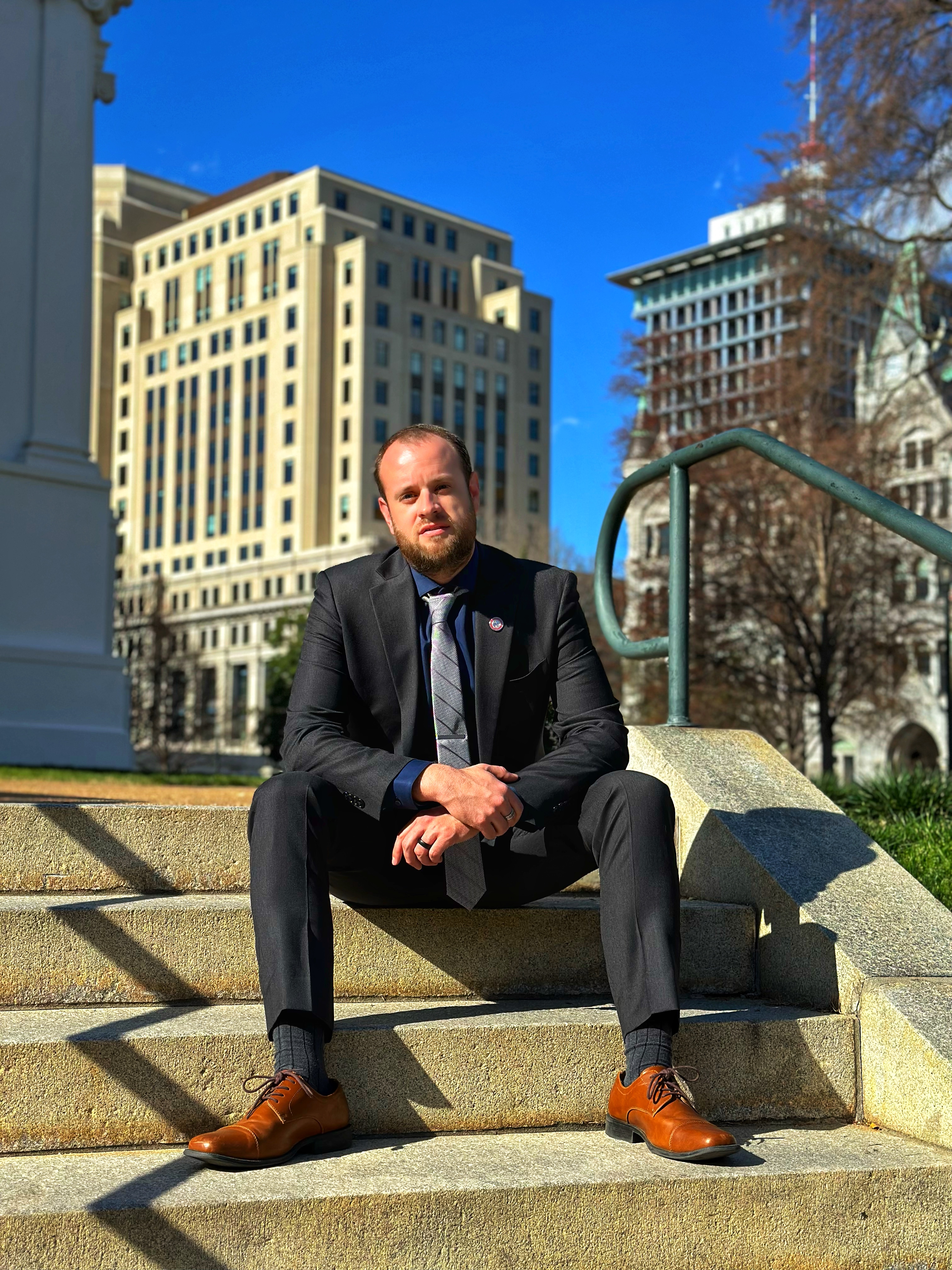 A person sitting on steps

AI-generated content may be incorrect.